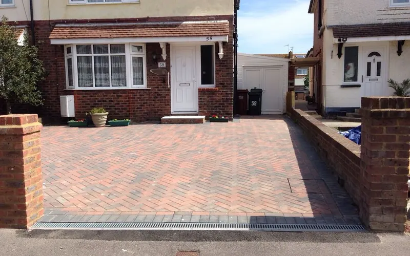 New block paved driveway with brick pillars laid by JFC Roofing and Building